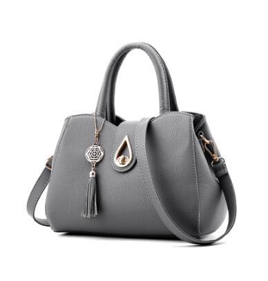 Luxury Demure Handbag   Ladies Tassel High Quality PU Leather